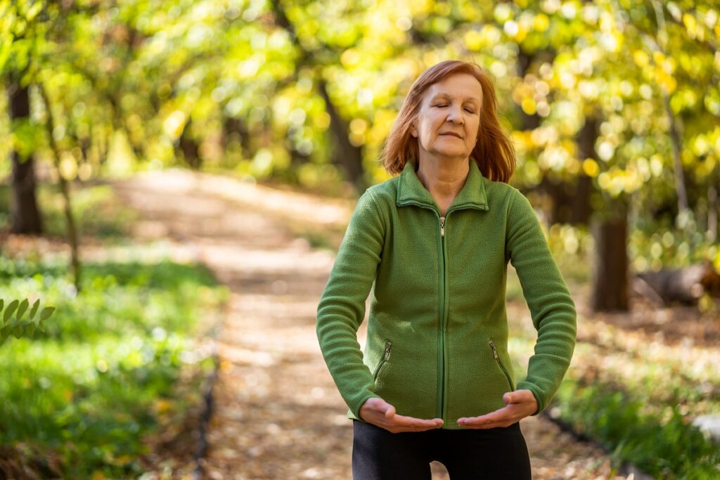 Woman practicing mindfulness outdoors