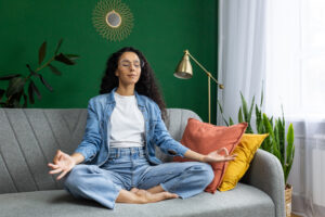 Woman meditating on couch