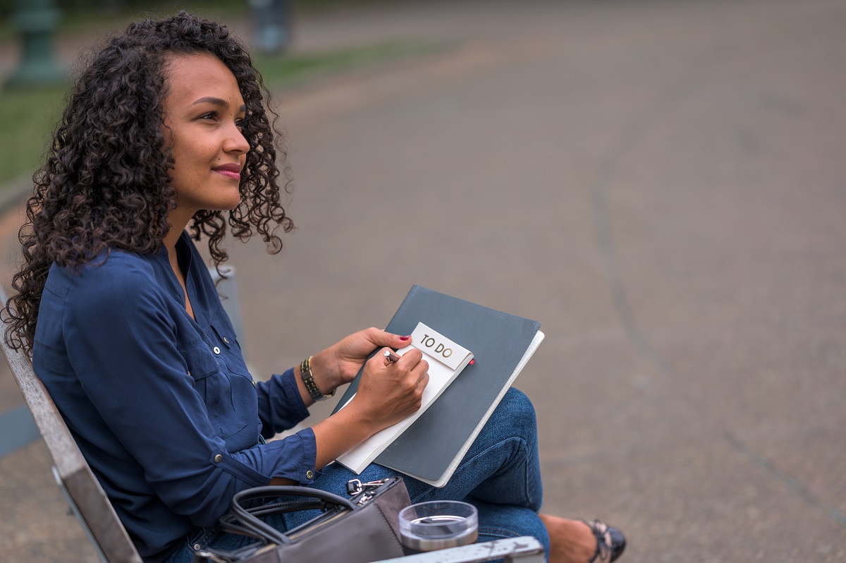 Woman writing a to-do list