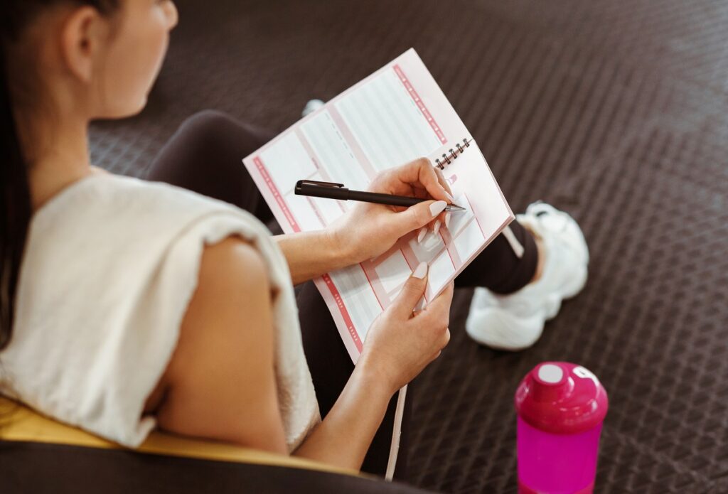 Woman writing in planner