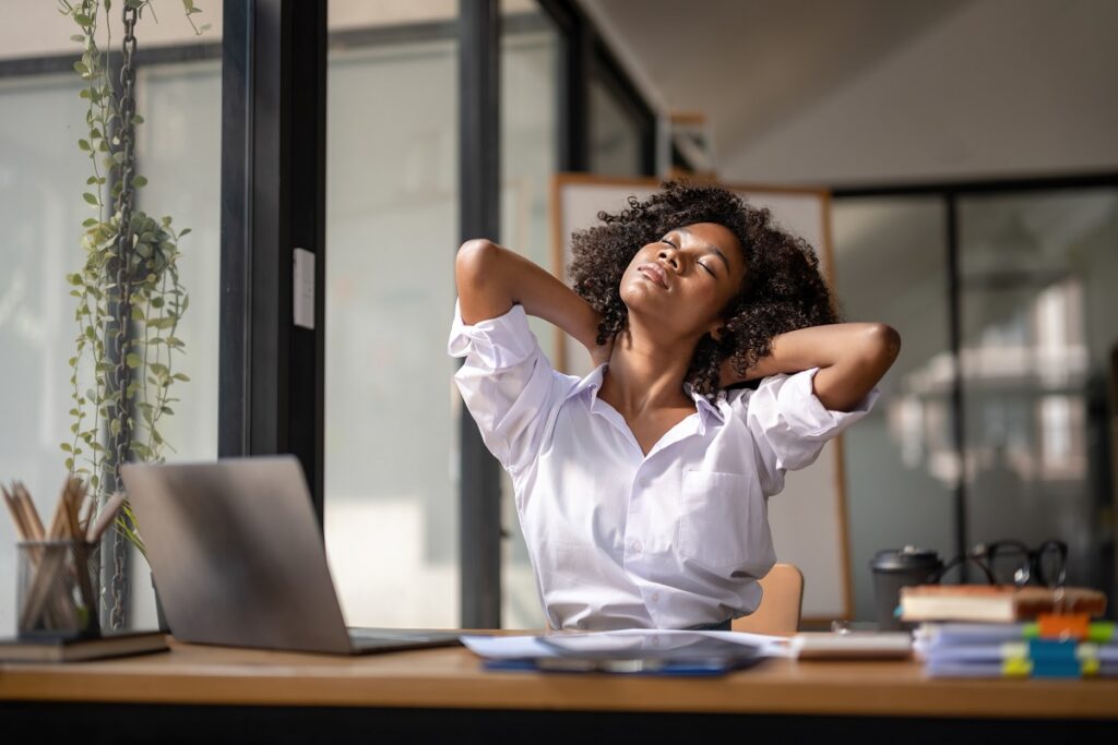 Woman relaxing at her desk