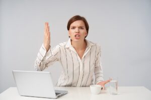 Woman expressing frustration at work