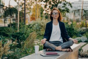 Woman meditating in park