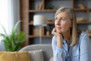 Thoughtful woman reflecting on challenges