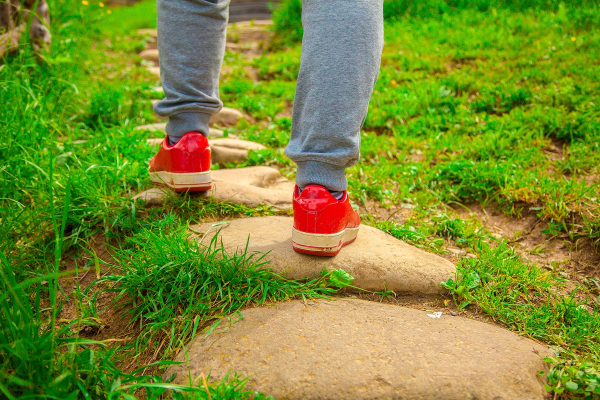 Red shoes on stepping stones